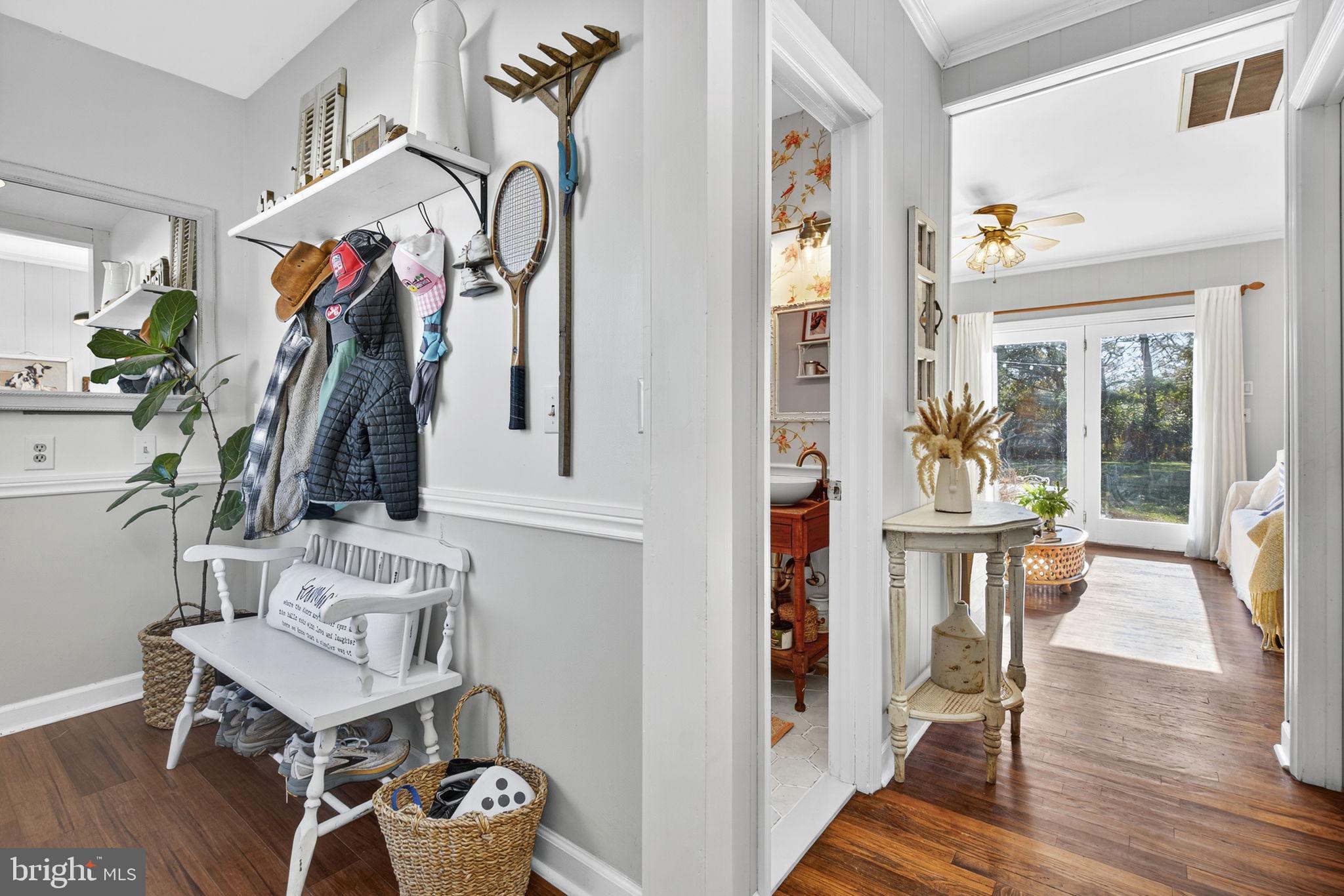 18321 Carrico Mills Road Stevensburg, VA 22741 - Photo 11 of 62 a view of hall way with furniture and wooden floor