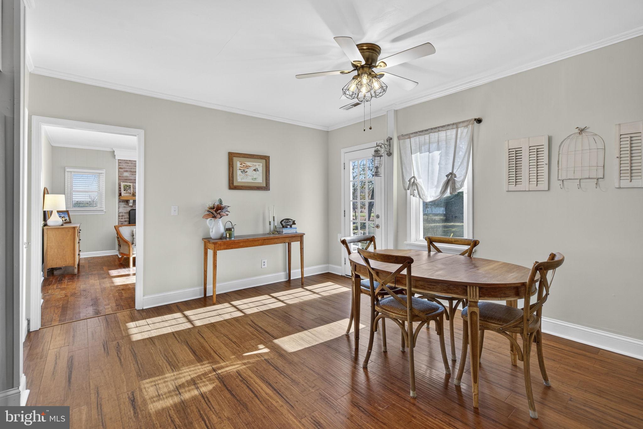 18321 Carrico Mills Road Stevensburg, VA 22741 - Photo 17 of 62 a view of a dining room with furniture and wooden floor