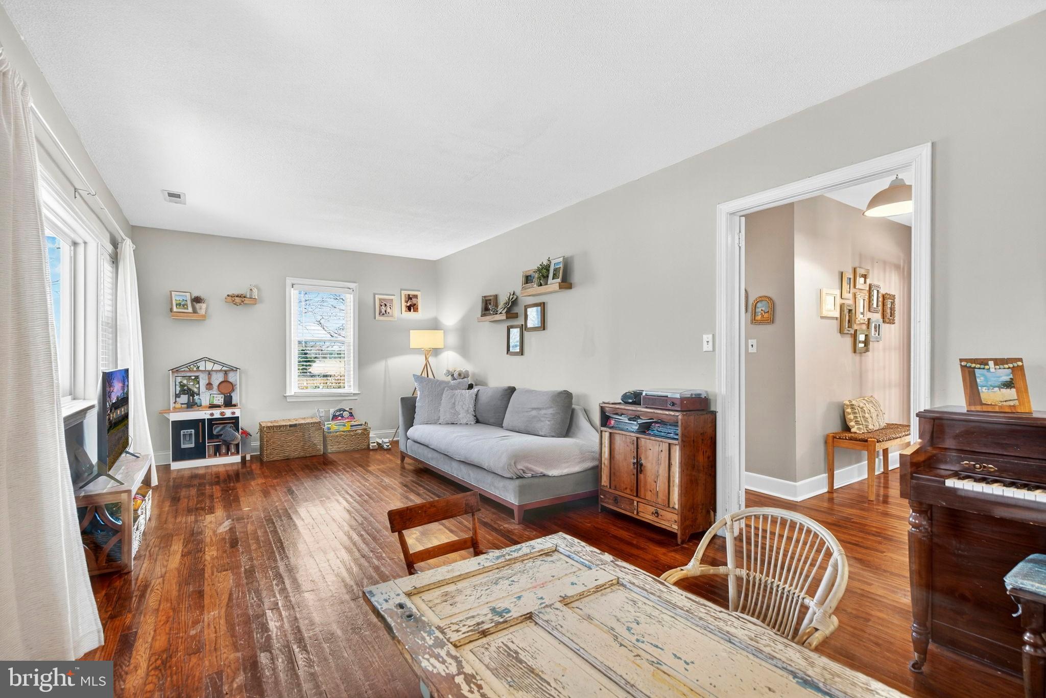 18321 Carrico Mills Road Stevensburg, VA 22741 - Photo 26 of 62 a living room with furniture and a wooden floor