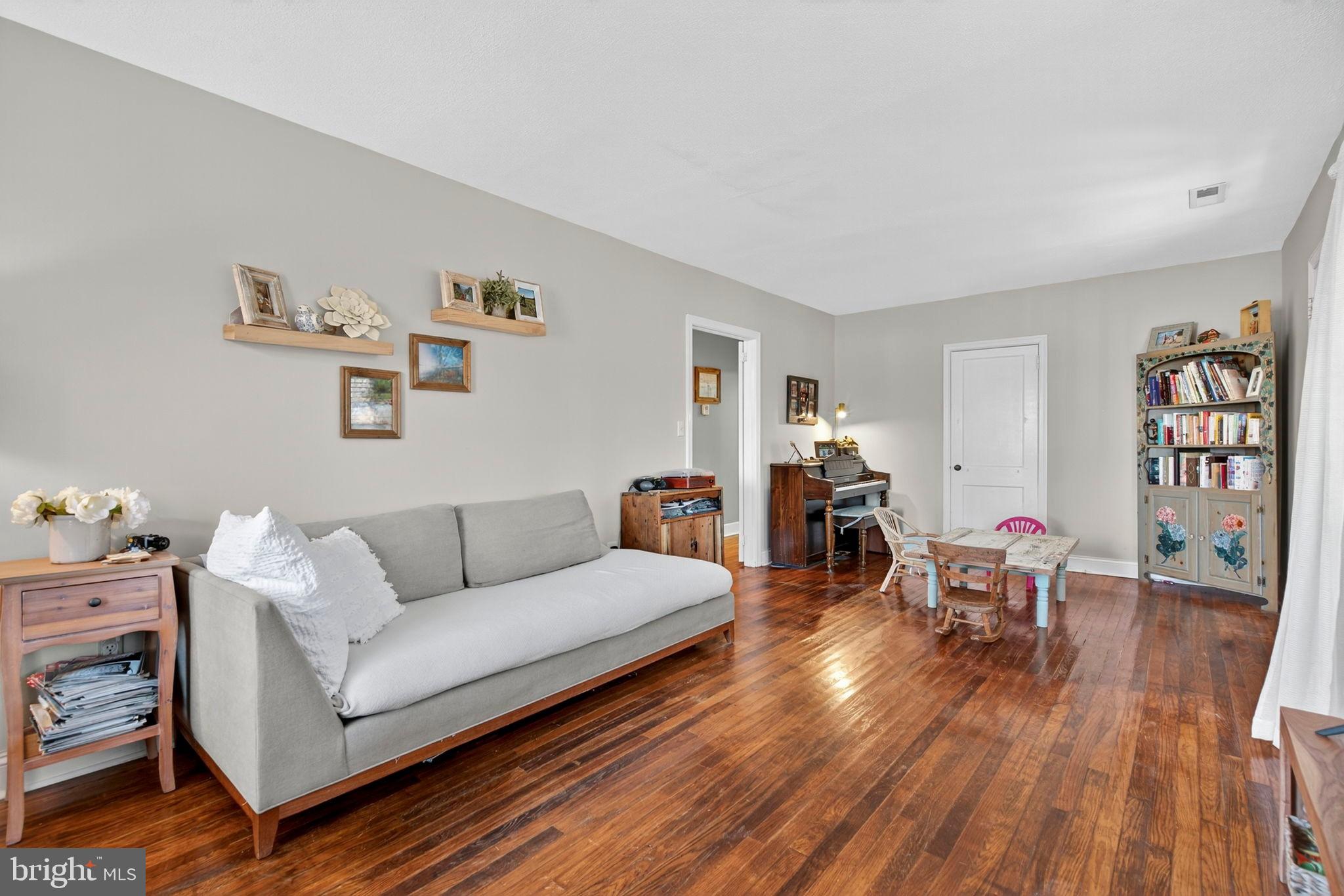 18321 Carrico Mills Road Stevensburg, VA 22741 - Photo 27 of 62 a living room with furniture and wooden floor