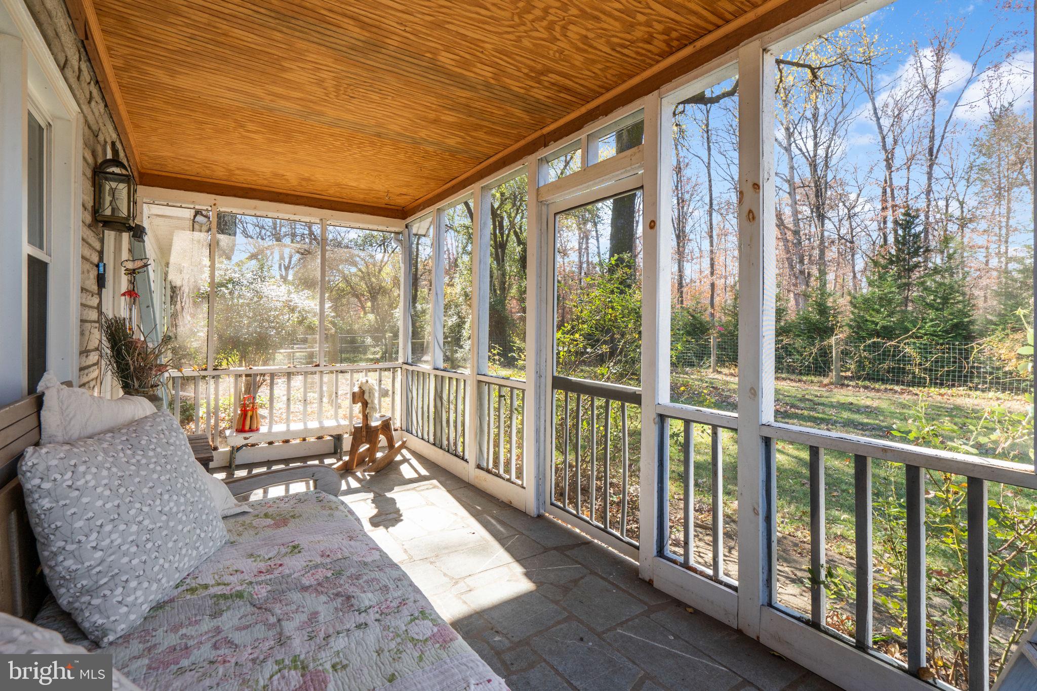 18321 Carrico Mills Road Stevensburg, VA 22741 - Photo 31 of 62 a living room with large windows and furniture