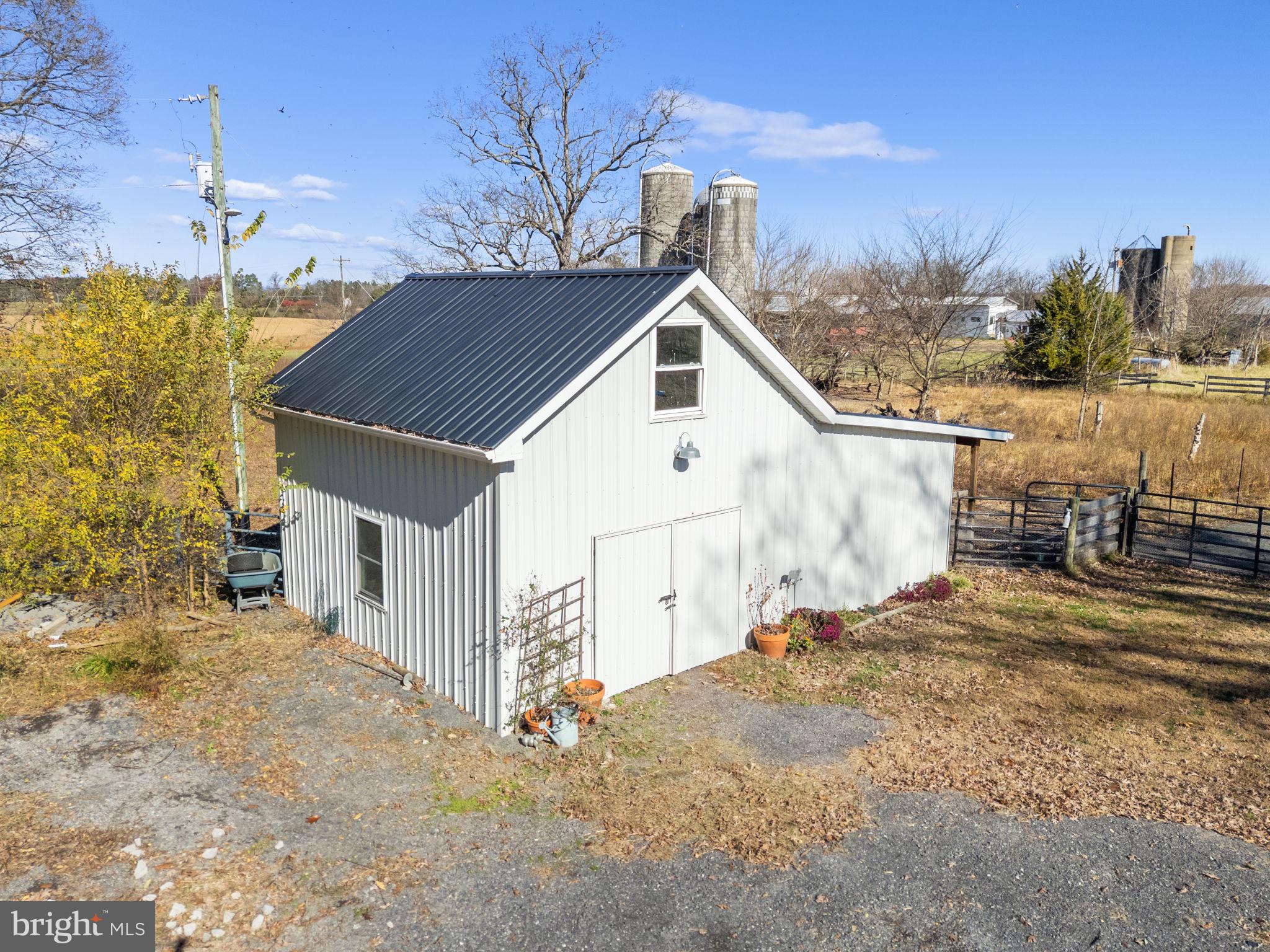 18321 Carrico Mills Road Stevensburg, VA 22741 - Photo 47 of 62 a view of a house with a yard
