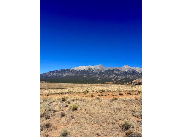 a view of mountain with sunset