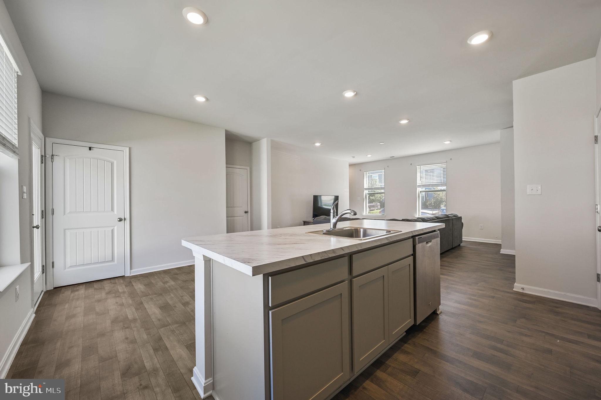 49 Citrus Drive Camden Wyoming, DE 19934 - Photo 15 of 27 a kitchen with a sink and wooden floor
