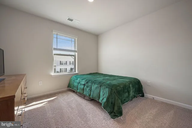 a room with a bed and a window