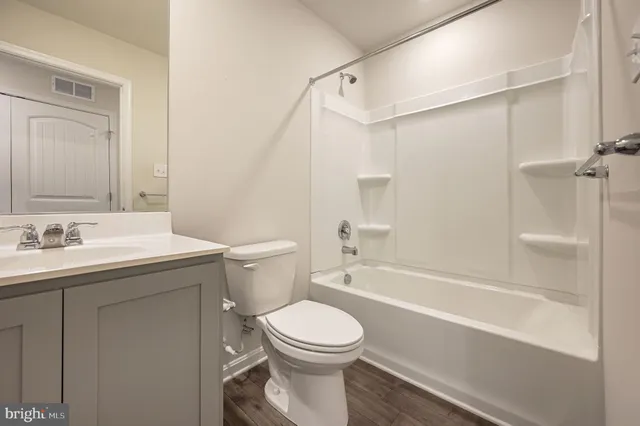 a bathroom with a sink a toilet and a bathtub