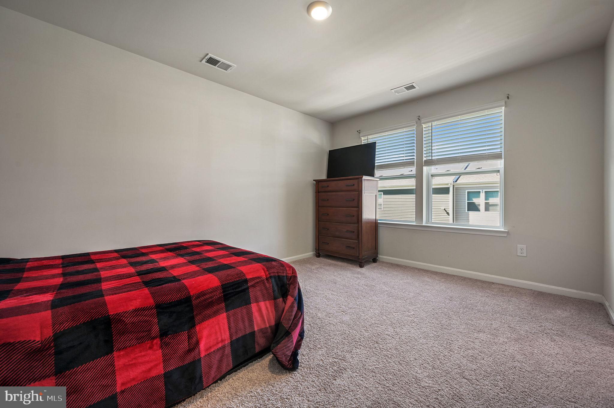 49 Citrus Drive Camden Wyoming, DE 19934 - Photo 24 of 27 a bedroom with a bed and a window