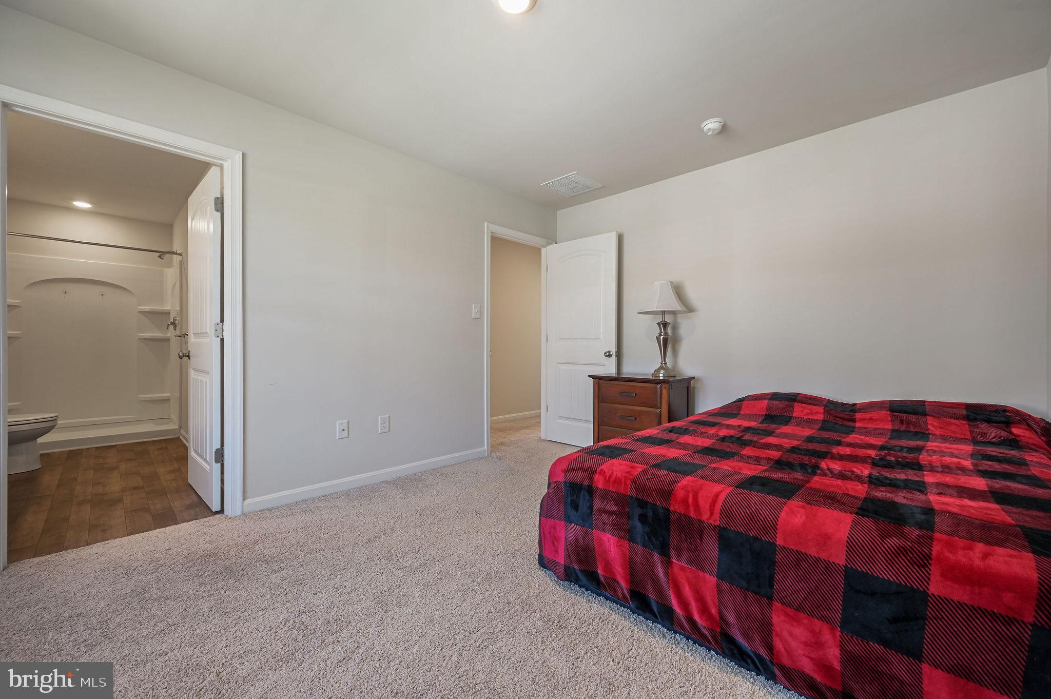 49 Citrus Drive Camden Wyoming, DE 19934 - Photo 25 of 27 a bedroom with a bed and a night stand