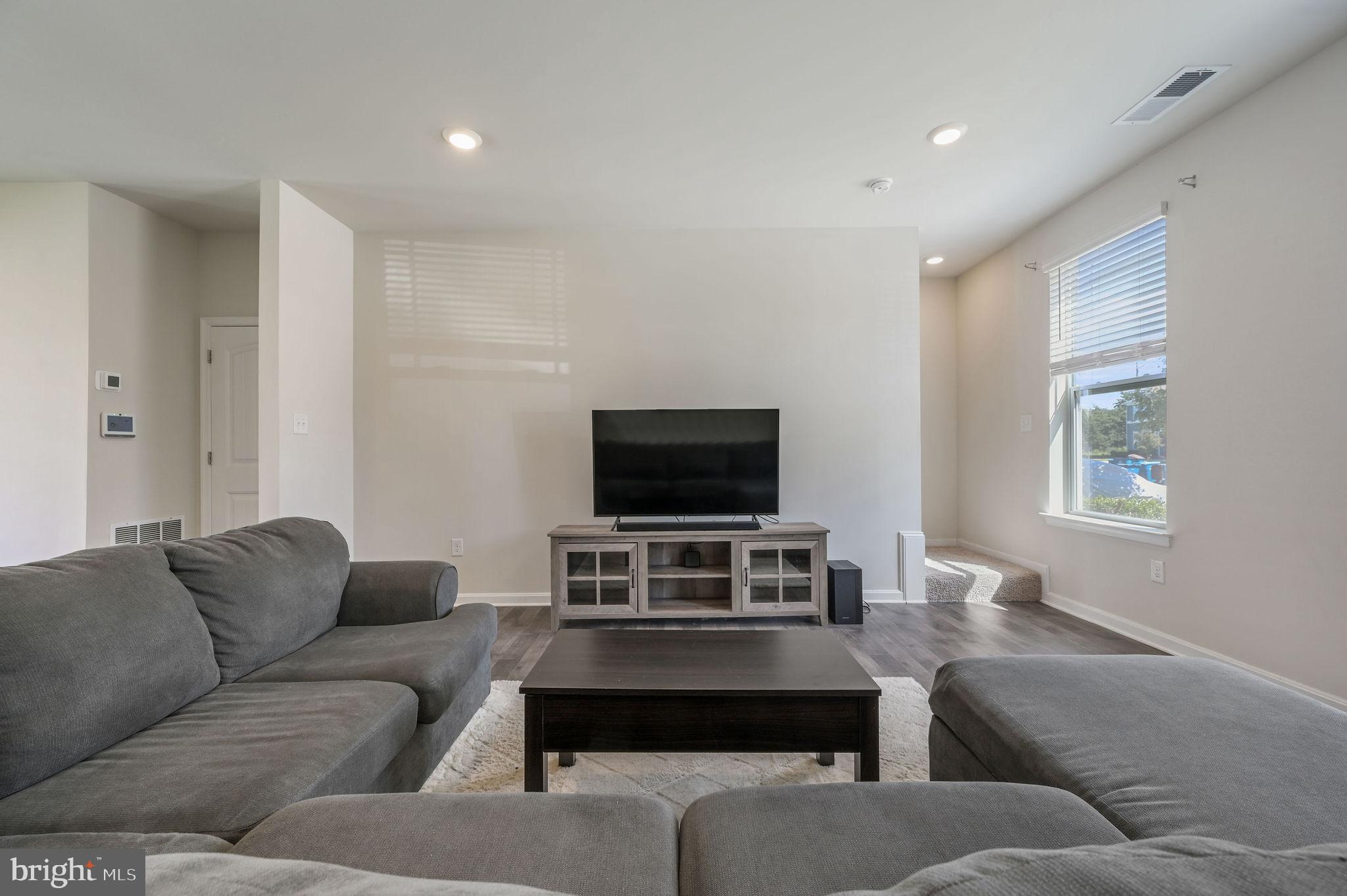 49 Citrus Drive Camden Wyoming, DE 19934 - Photo 6 of 27 a living room with furniture and a flat screen tv