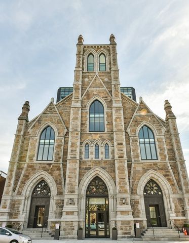 a view of a brick building with many windows