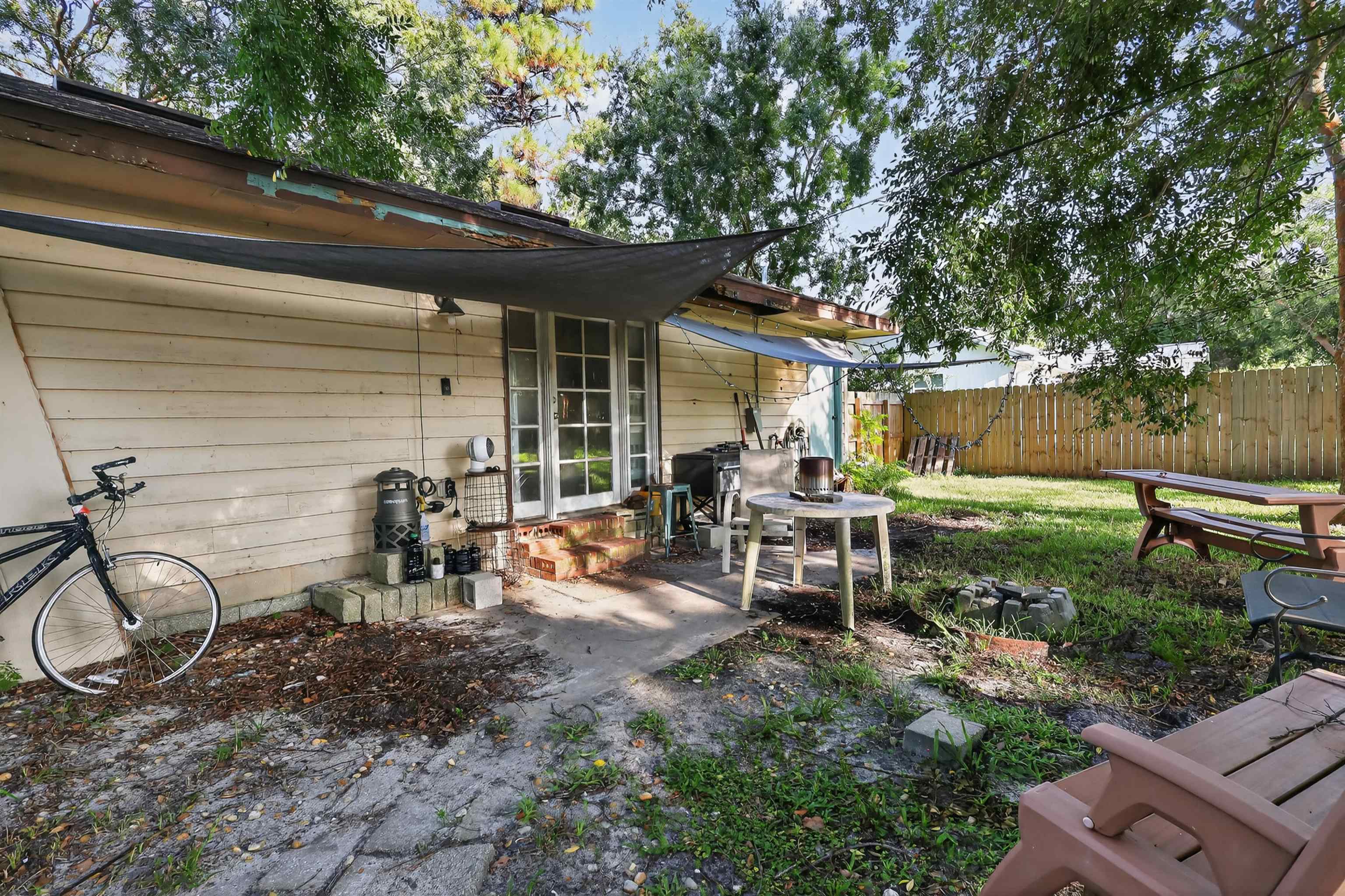130 Cornell Road St. Augustine, FL 32086 - Photo 22 of 24 a view of a chair and table in backyard of the house