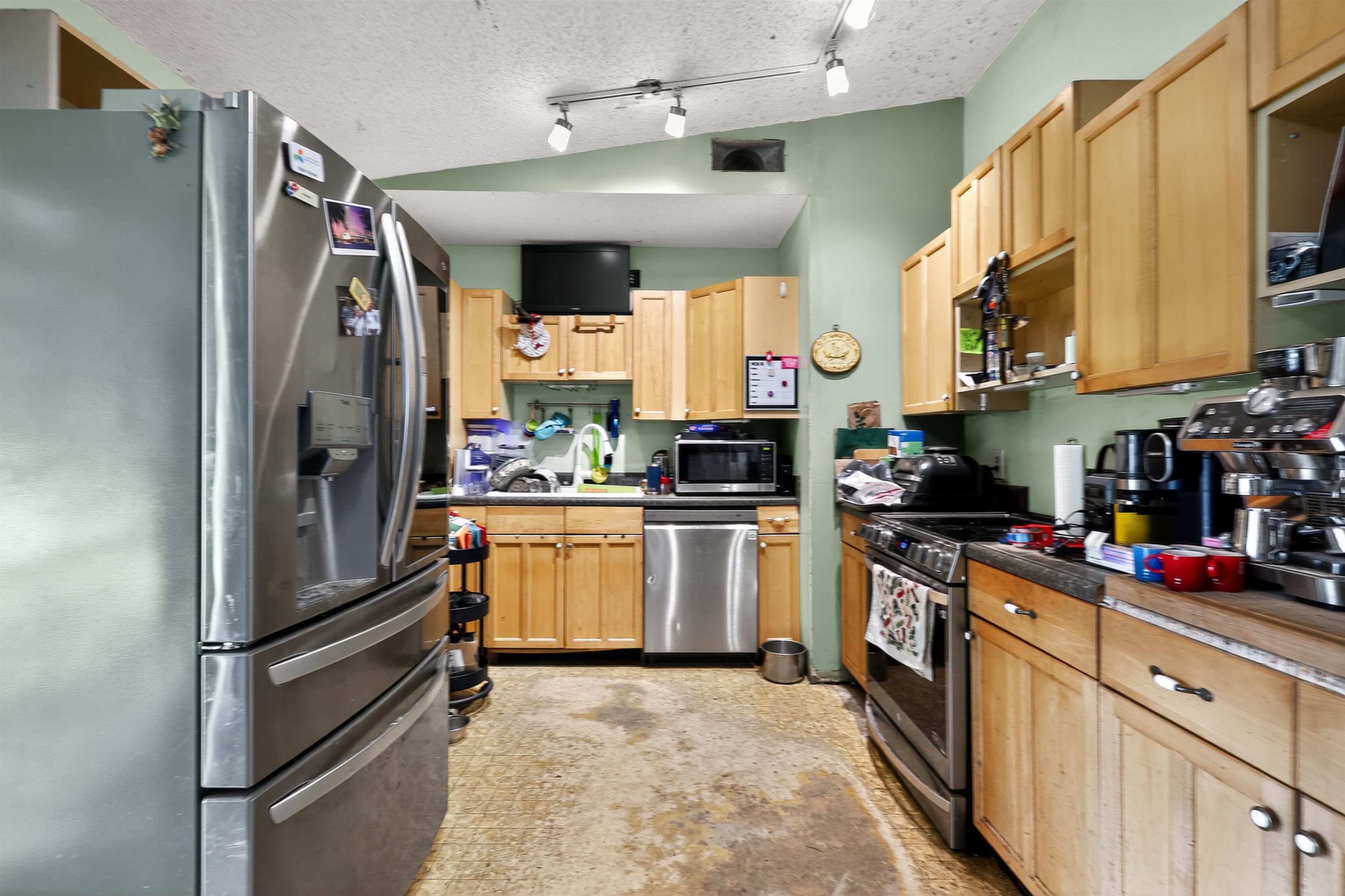 130 Cornell Road St. Augustine, FL 32086 - Photo 6 of 24 a kitchen with stainless steel appliances a refrigerator sink and cabinets