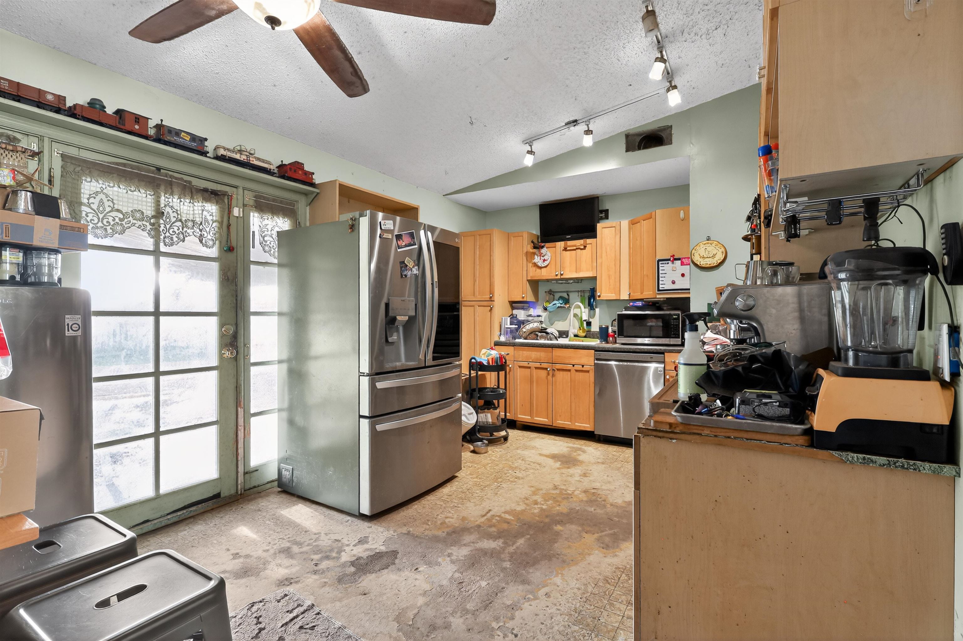 130 Cornell Road St. Augustine, FL 32086 - Photo 7 of 24 a kitchen with refrigerator and cabinets