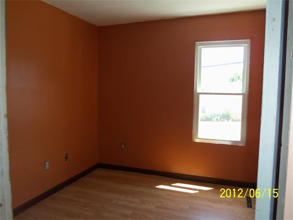 36 Branch Street Fall River, MA 02721 - Photo 5 of 8 an empty room with wooden floor and windows