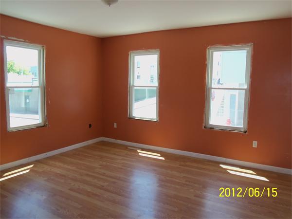 36 Branch Street Fall River, MA 02721 - Photo 7 of 8 a view of an empty room with wooden floor and a window