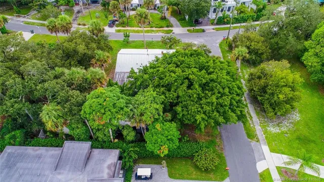 an aerial view of a house with pool