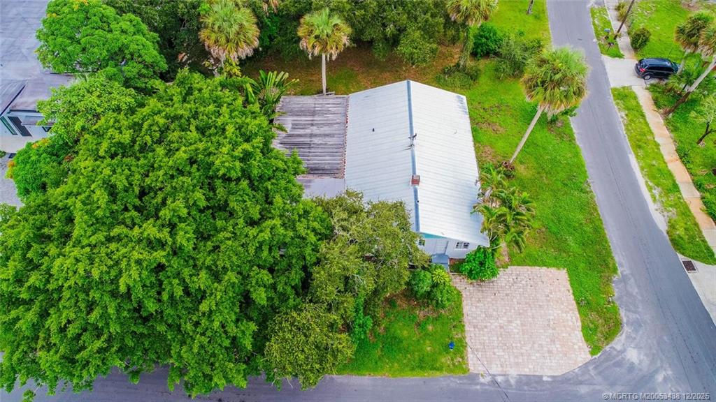 817 Southwest St Lucie Crescent Stuart, FL 34994 - Photo 4 of 25 an aerial view of a house with a yard and garden