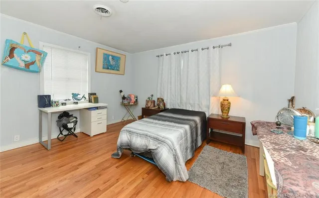 a bedroom with a bed and a table in it