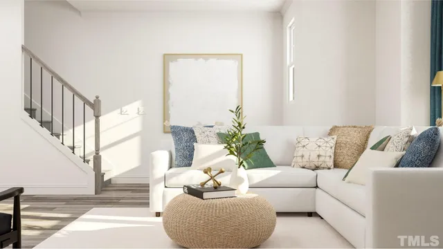 a living room with furniture and white walls
