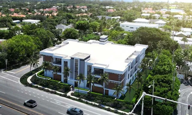 an aerial view of multiple houses with yard