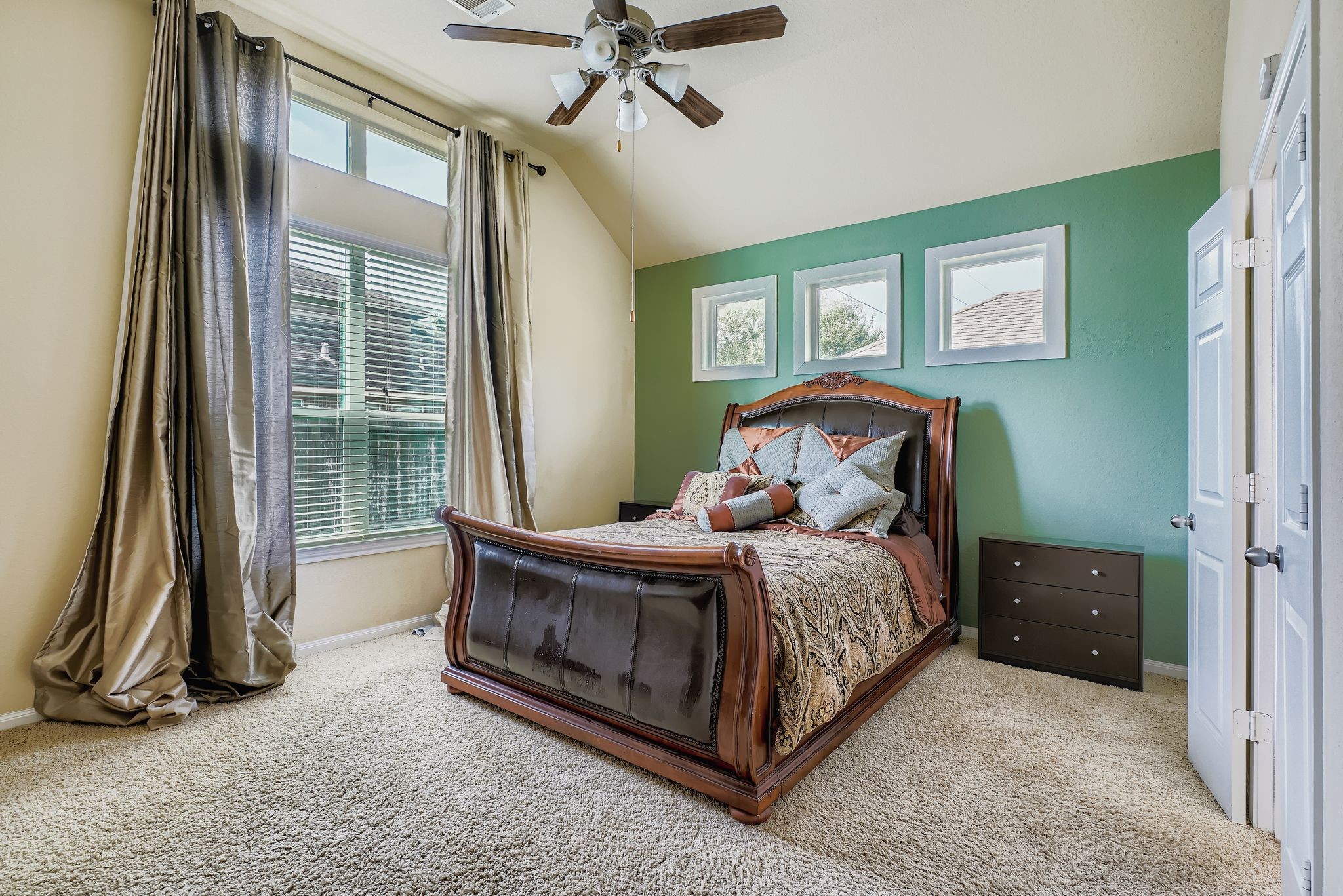 2227 Wembley Way Rosenberg, TX 77471 - Photo 14 of 27 a bedroom with a bed and a chandelier