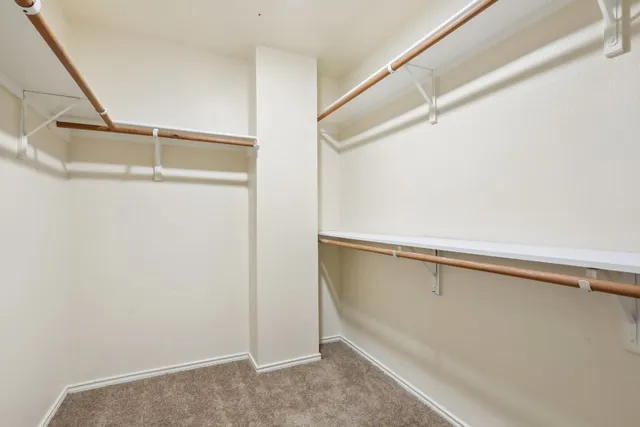 a view of an empty walk in closet