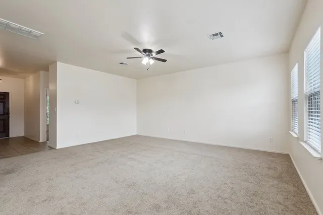 a view of an empty room with a window