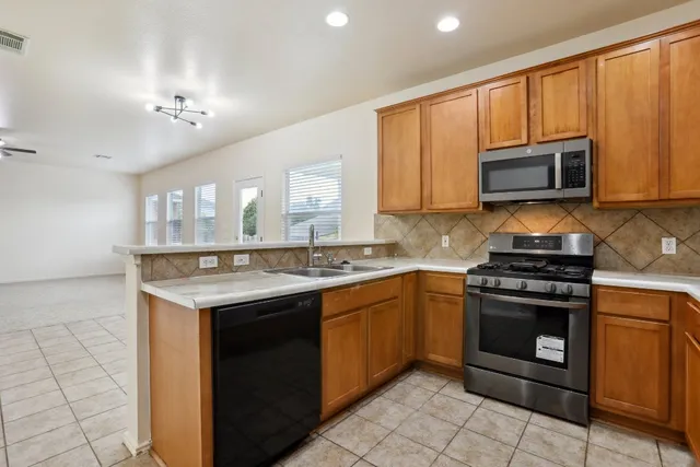 a kitchen with a stove and a sink