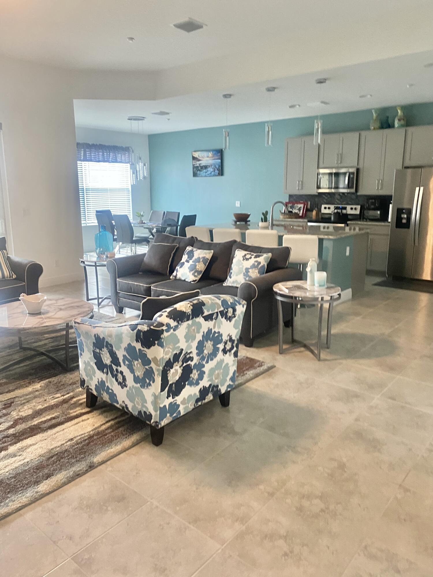 656 Southwest Haas Avenue Port St. Lucie, FL 34953 - Photo 11 of 31 a living room with lots of furniture and kitchen view