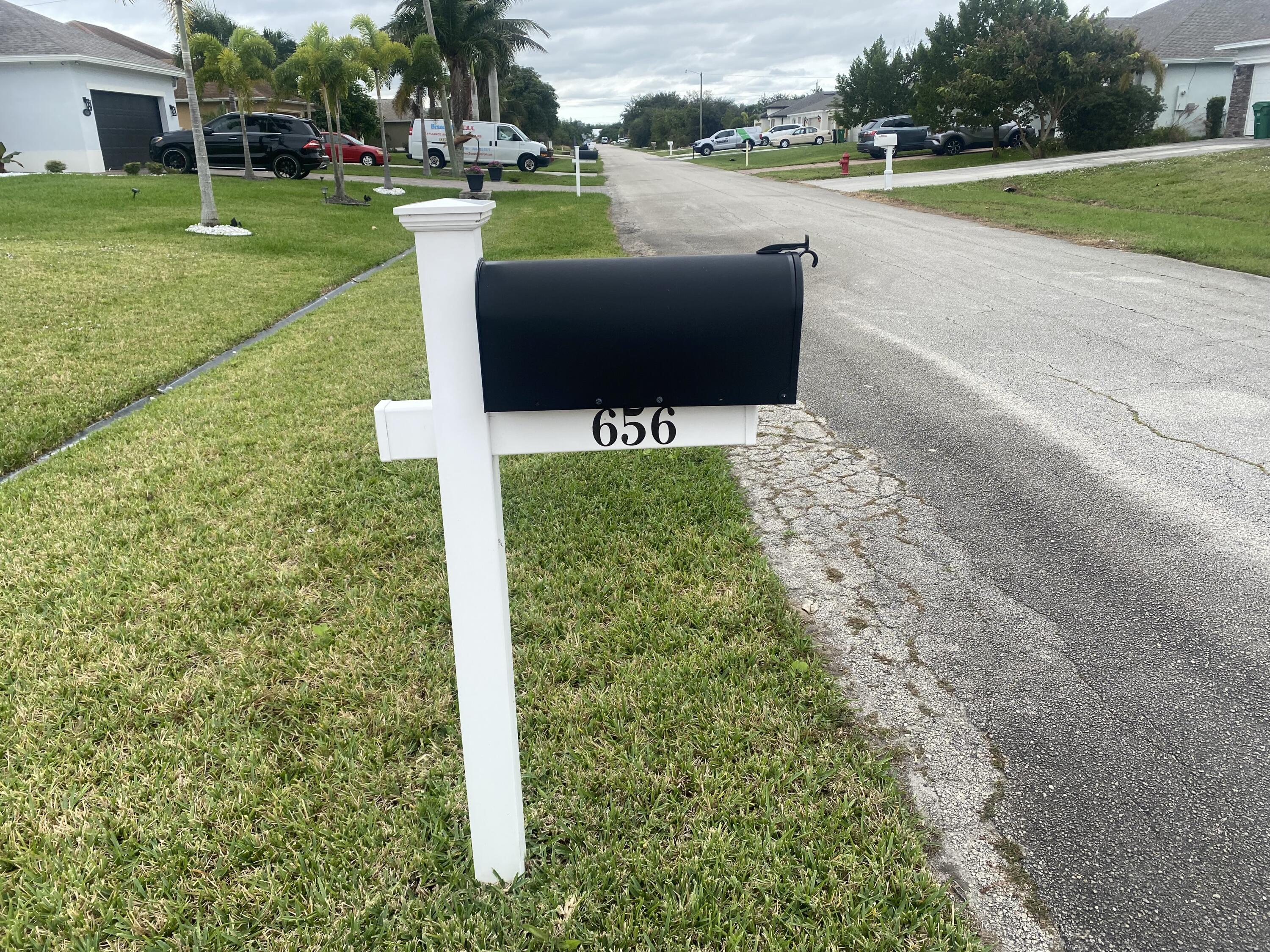 656 Southwest Haas Avenue Port St. Lucie, FL 34953 - Photo 2 of 31 a view of a garden with sitting area