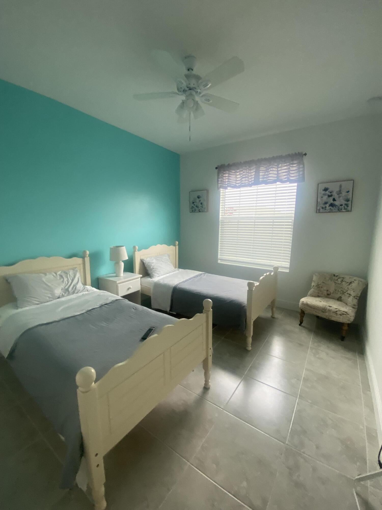 656 Southwest Haas Avenue Port St. Lucie, FL 34953 - Photo 23 of 31 a living room with furniture and a large window
