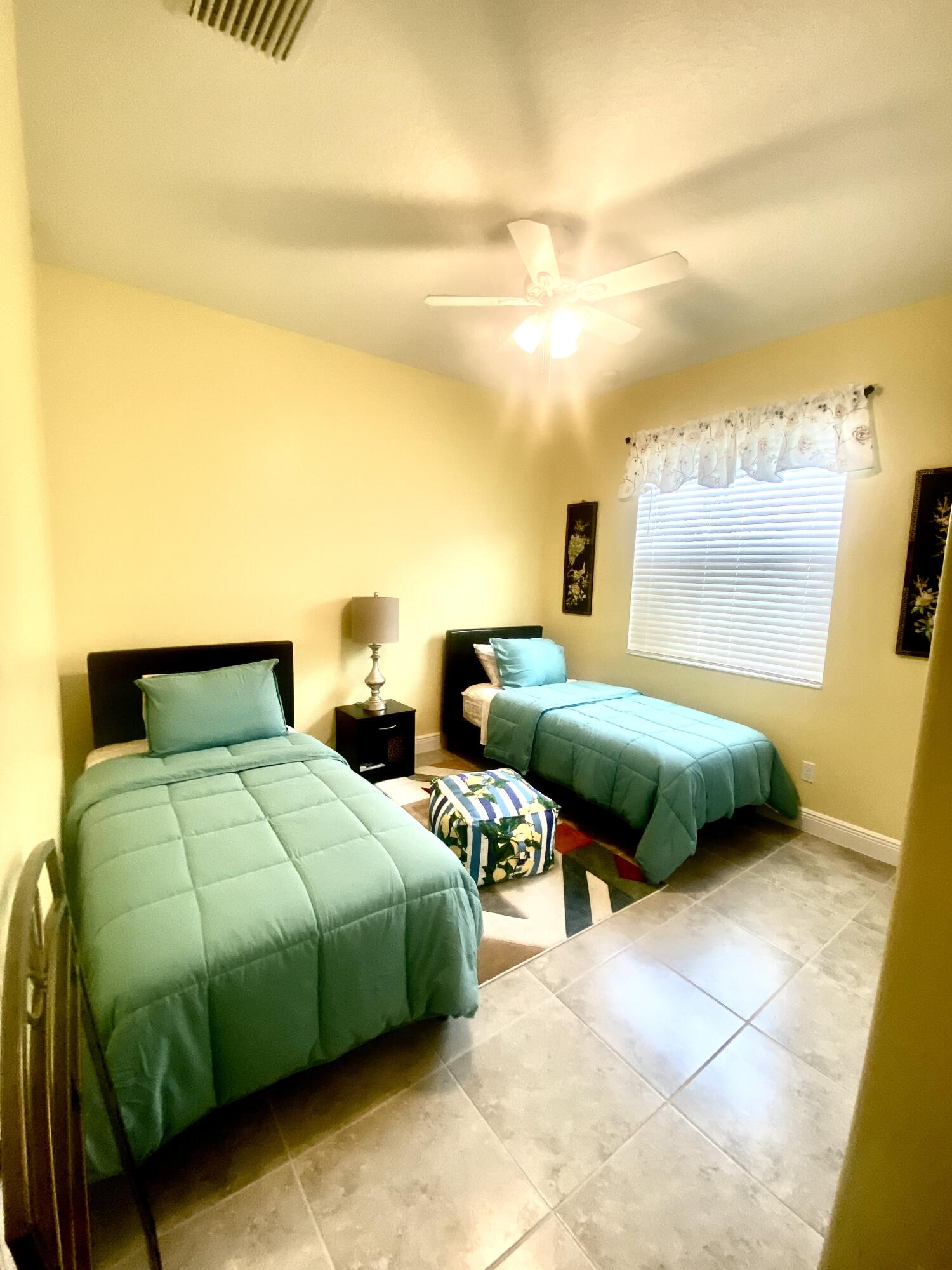 656 Southwest Haas Avenue Port St. Lucie, FL 34953 - Photo 25 of 31 a bathroom with 2 sink and a mirror