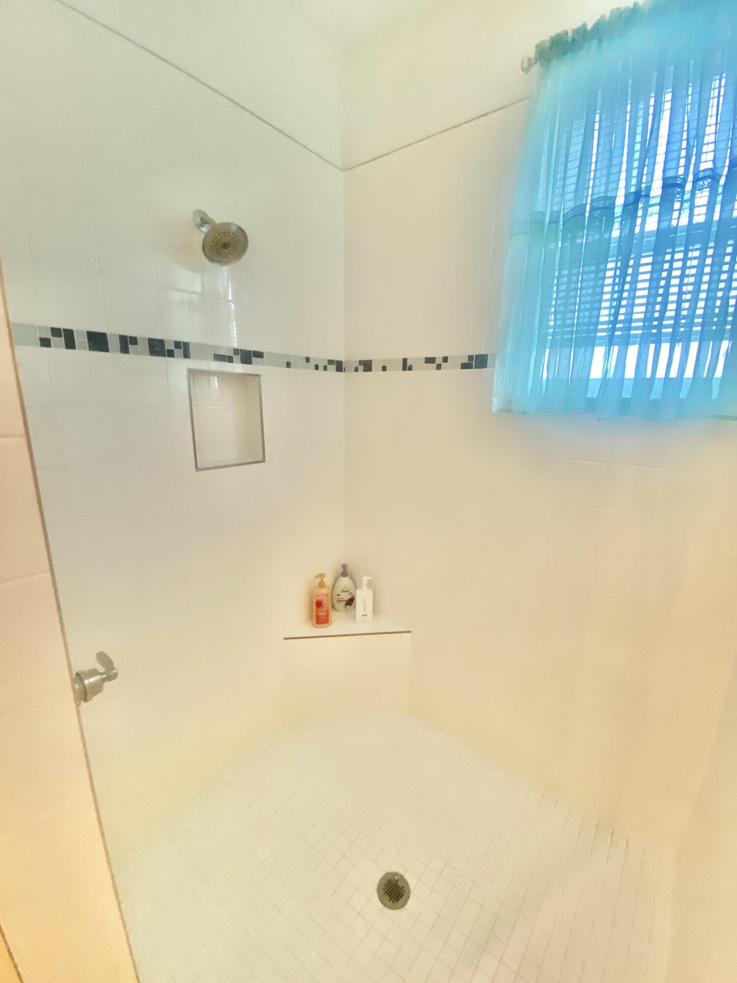 656 Southwest Haas Avenue Port St. Lucie, FL 34953 - Photo 28 of 31 a bathroom with a shower