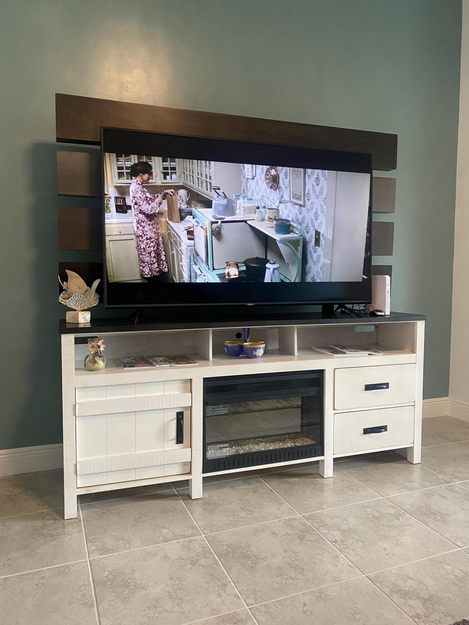 656 Southwest Haas Avenue Port St. Lucie, FL 34953 - Photo 8 of 31 a view of fireplace with cabinet