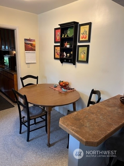 1505 J Street Walla Walla, WA 99362 - Photo 4 of 11 a view of a dining room with furniture and wooden floor