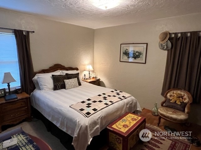 1505 J Street Walla Walla, WA 99362 - Photo 5 of 11 a bedroom with a bed and a lamp with the dresser