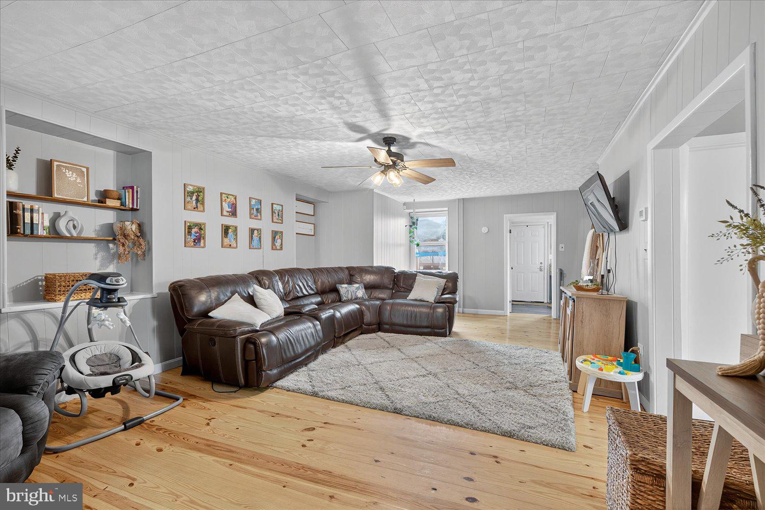 1235 Reading Road Denver, PA 17517 - Photo 5 of 33 a living room with furniture and a chandelier