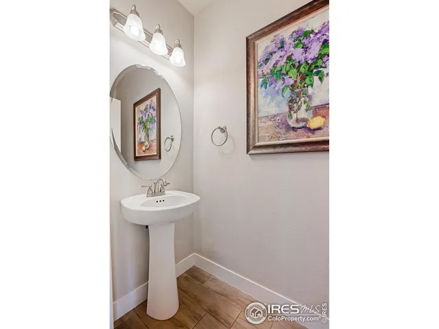 a kitchen with kitchen island granite countertop a sink stainless steel appliances and cabinets