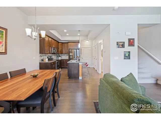 a view of a dining room with furniture and window