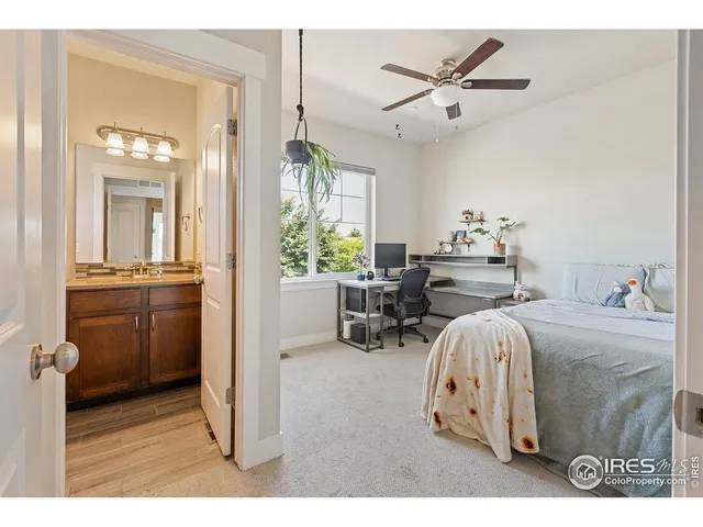 a bathroom with a sink a toilet a mirror and shower