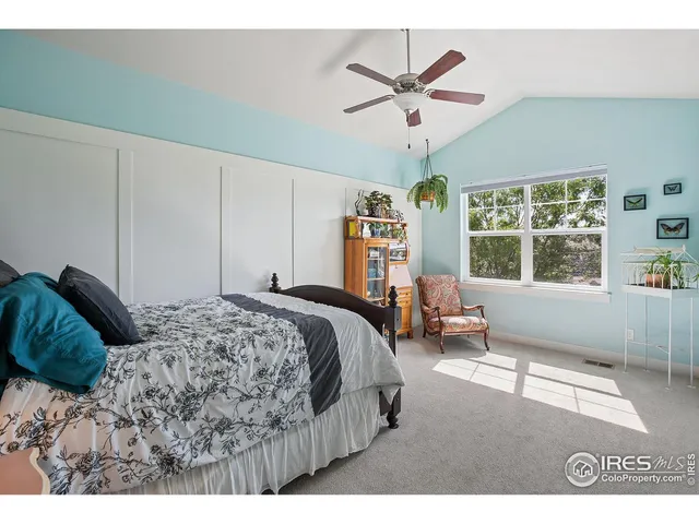 a bedroom with furniture and a chandelier