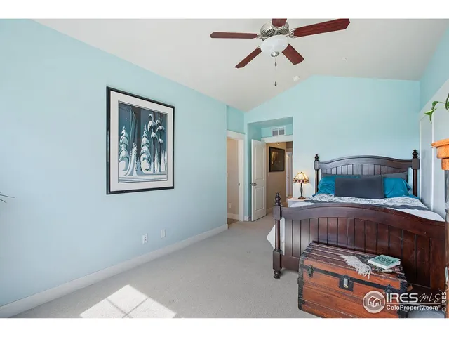 a bedroom with furniture and a chandelier