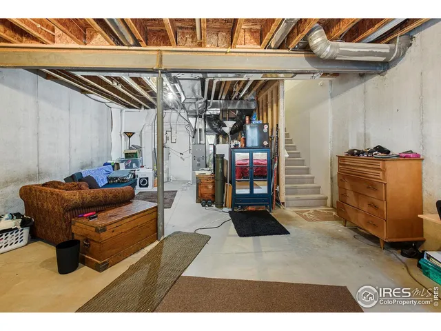 a living room with furniture a flat screen tv and a floor