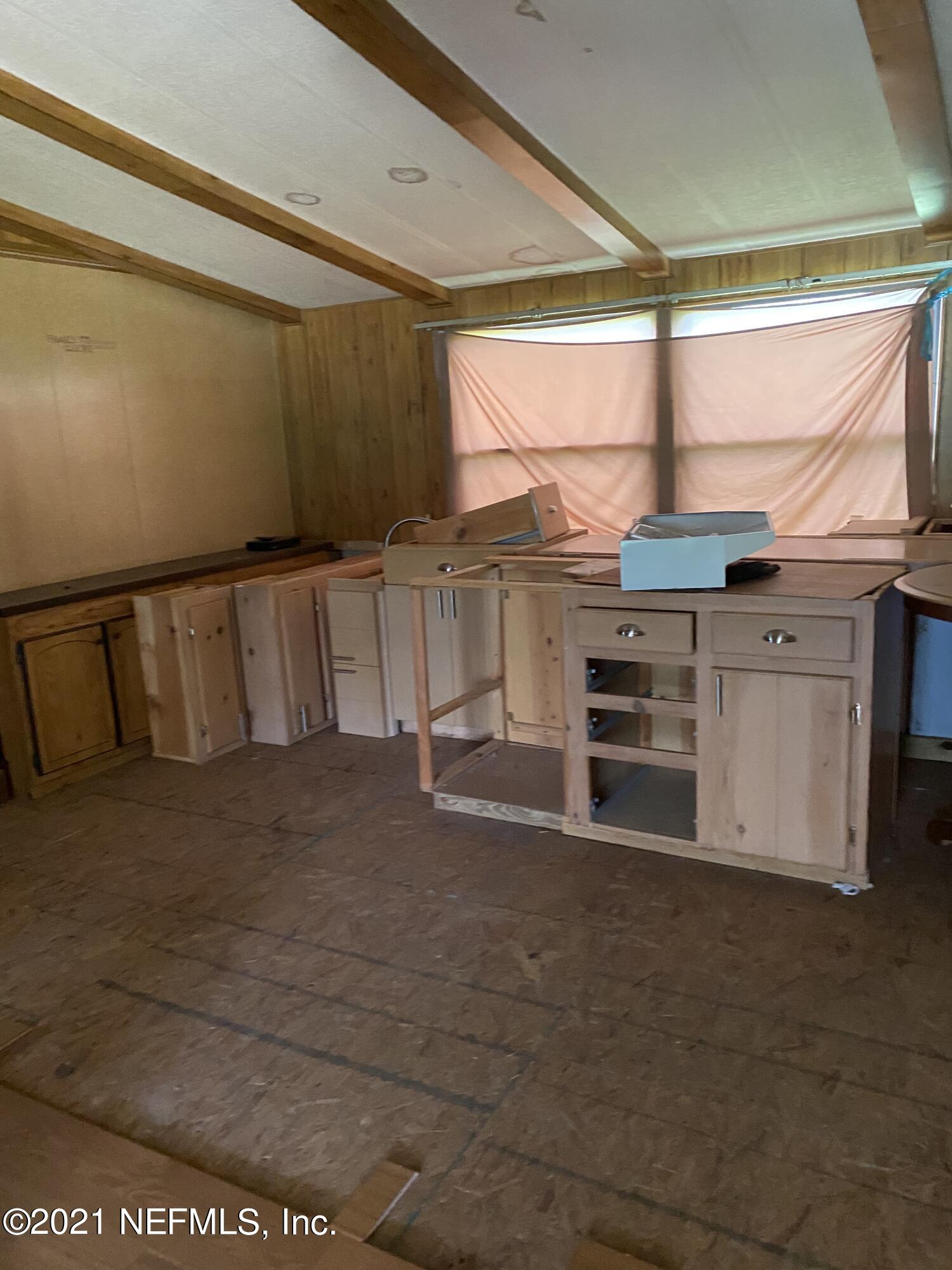 140 Keystone Road Palatka, FL 32177 - Photo 6 of 33 a view of a kitchen with furniture and window