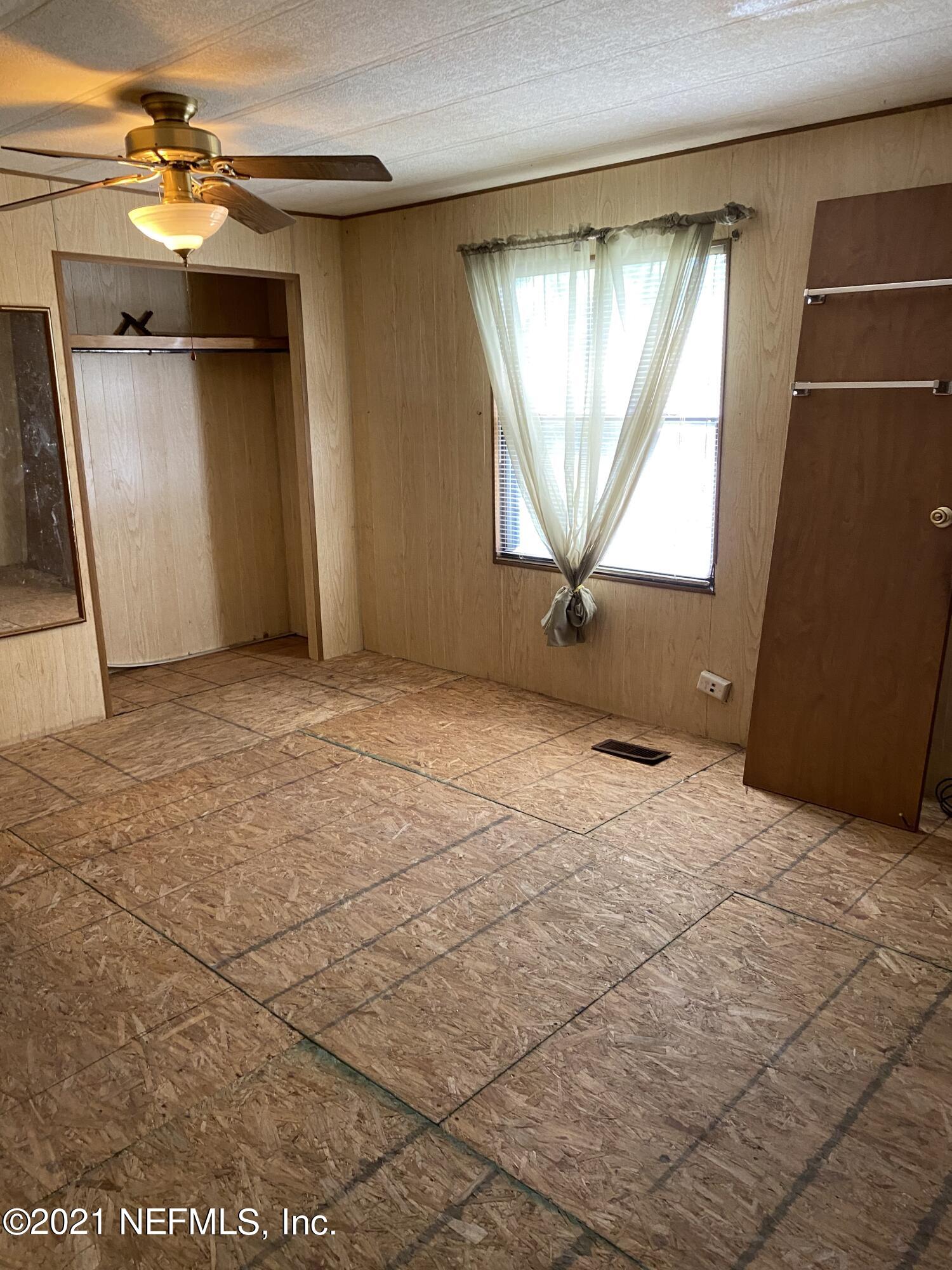 140 Keystone Road Palatka, FL 32177 - Photo 8 of 33 an empty room with windows and closet