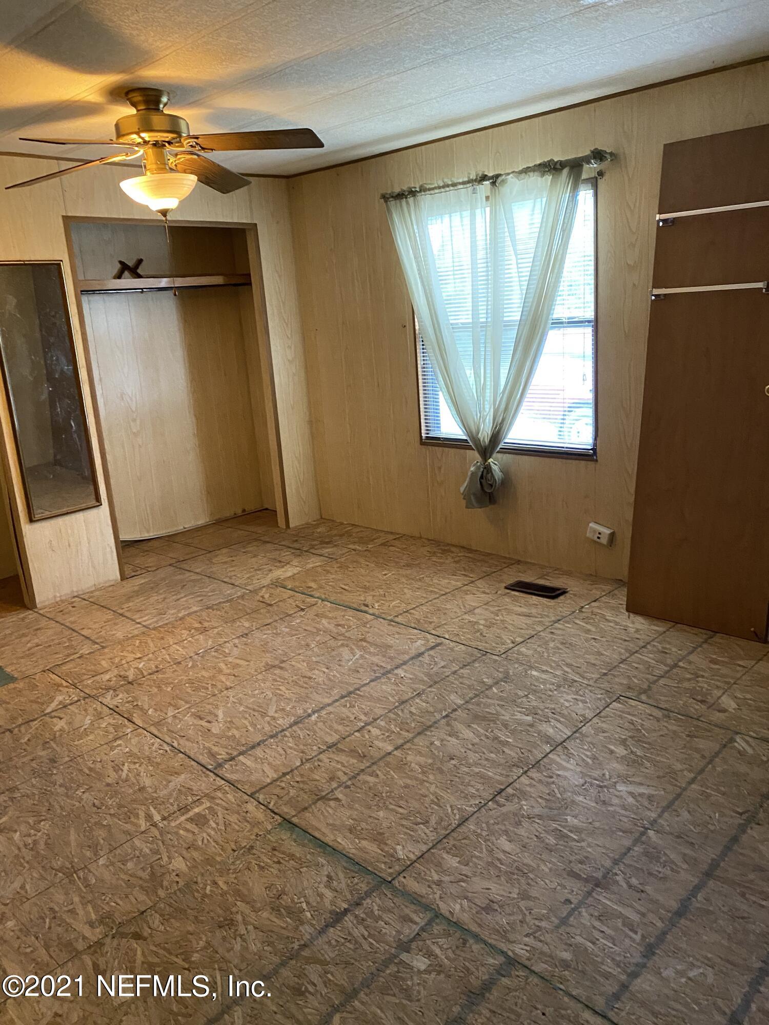 140 Keystone Road Palatka, FL 32177 - Photo 10 of 33 an empty room with windows and door