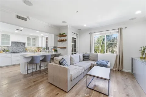 a kitchen with stainless steel appliances granite countertop a refrigerator and a stove