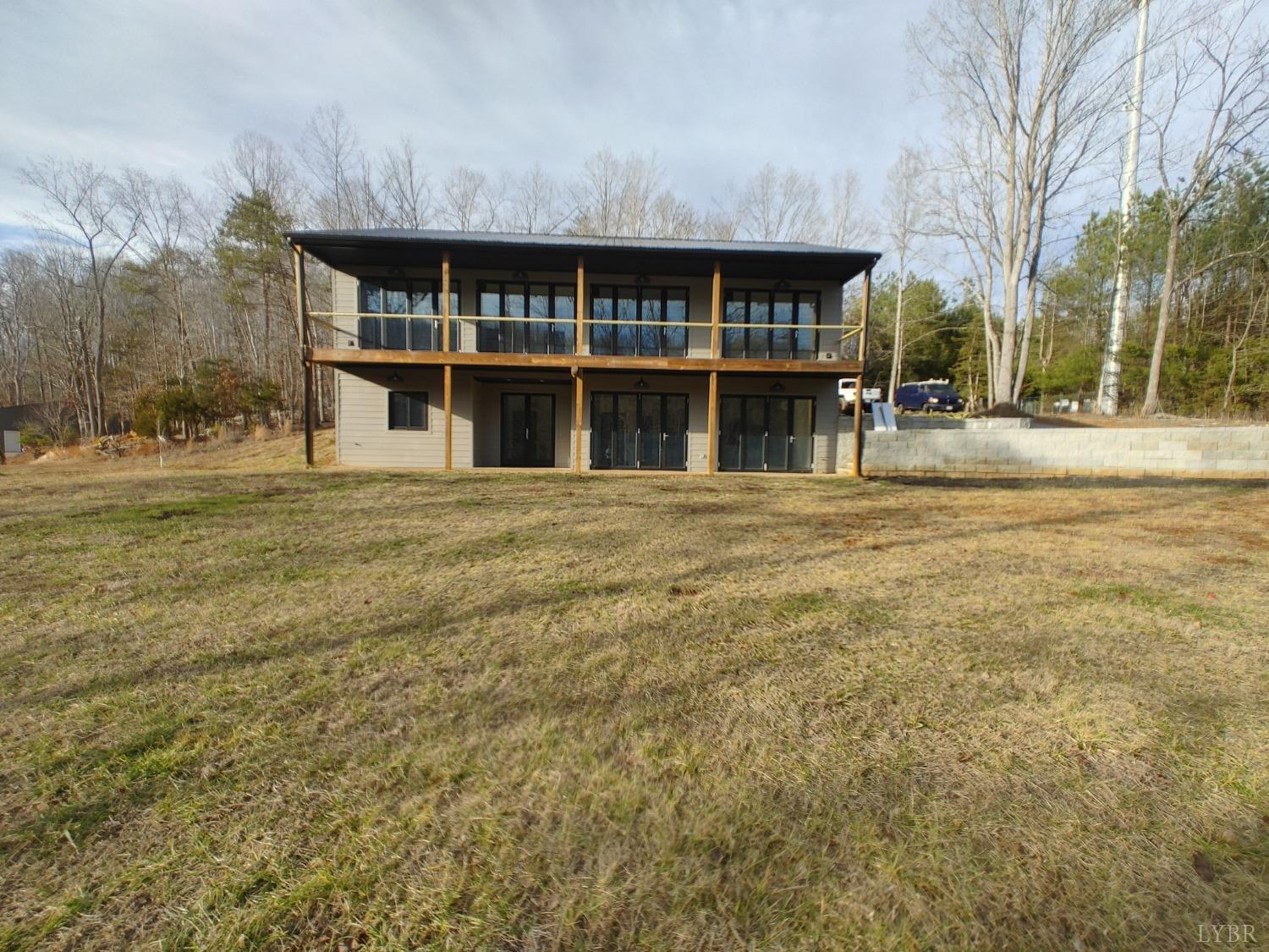 8915 Charlemont Road Goode, VA 24556 - Photo 1 of 96 a front view of a building with a garden
