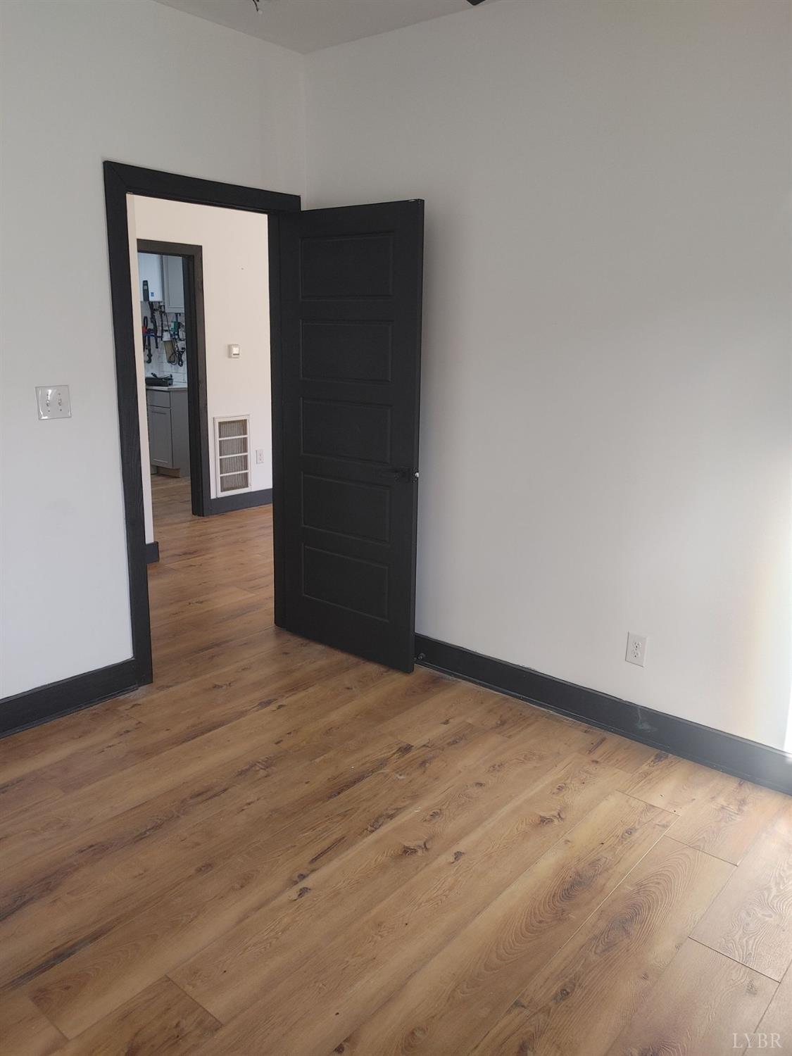 8915 Charlemont Road Goode, VA 24556 - Photo 28 of 96 a view of an empty room with wooden floor and closet