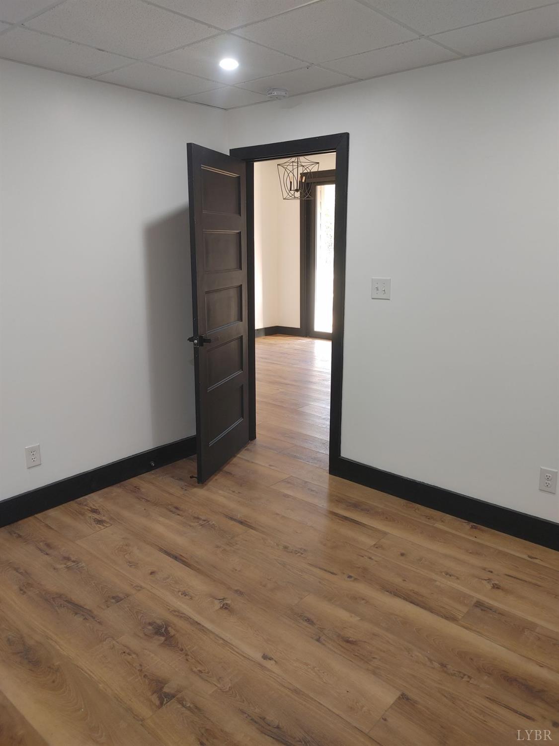 8915 Charlemont Road Goode, VA 24556 - Photo 29 of 96 a view of an empty room with wooden floor and closet